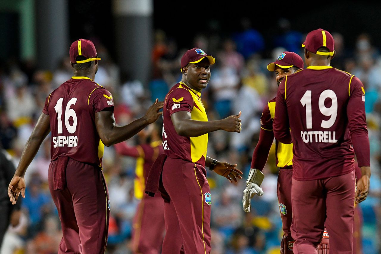 Rovman Powell celebrates a wicket with his team-mates, West Indies vs England, Kensington Oval, Barbados, 3rd T20I, January 26, 2022
