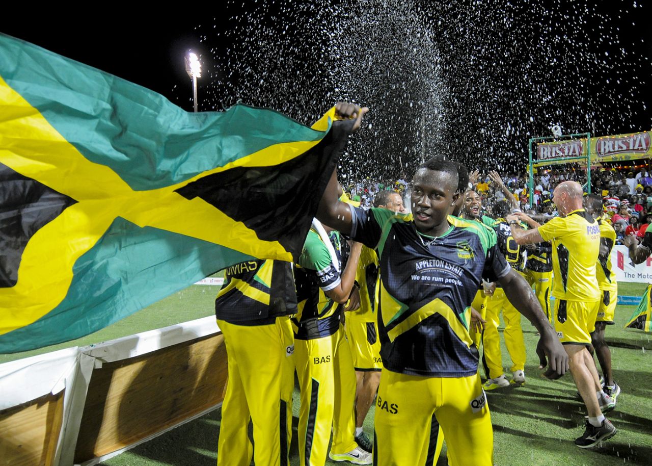 Rovman Powell holds up a Jamaica flag after winning the CPL, CPL 2016, final, St Kitts, August 7, 2016