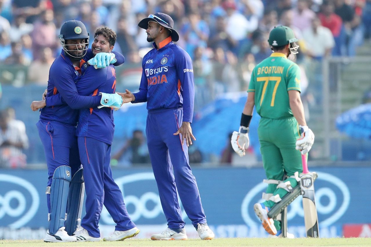 Sanju Samson embraces Kuldeep Yadav, as Bjorn Fortuin walks back, India vs South Africa, 3rd ODI, Delhi, October 11, 2022
