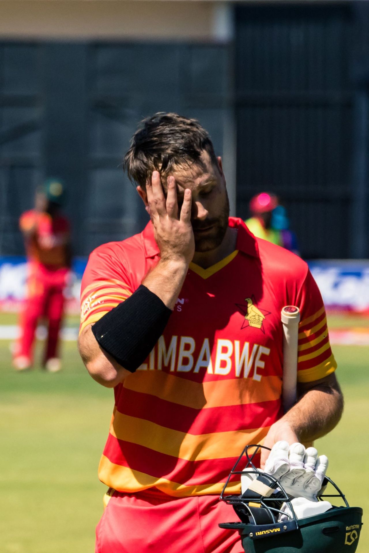 Ryan Burl walks back after being dismissed by Prasidh Krishna, 1st ODI, Zimbabwe vs India, Harare, August 18, 2022