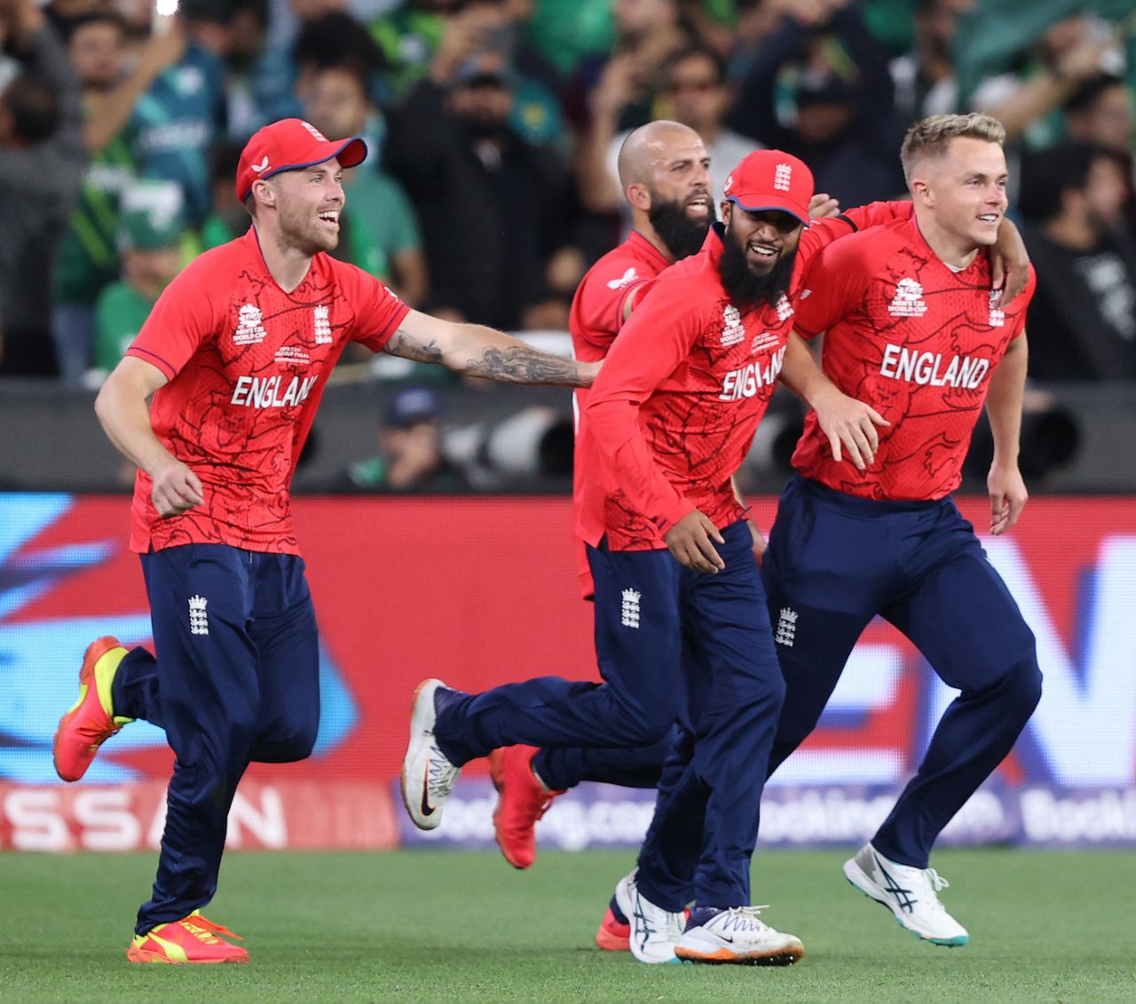 Sam Curran and Adil Rashid, who played key roles in England's win, lead the race out to the middle, England vs Pakistan, T20 World Cup, final, November 13, 2022