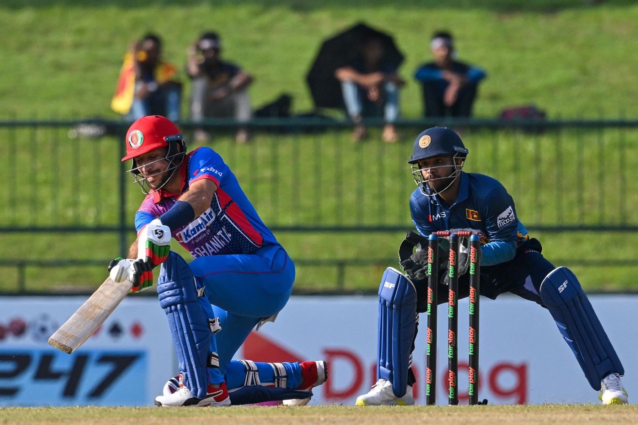 Rahmat Shah scoops one over the wicketkeeper as Kusal Mendis watches on, Sri Lanka vs Afghanistan, 1st men's ODI, Pallekele, November 25, 2022