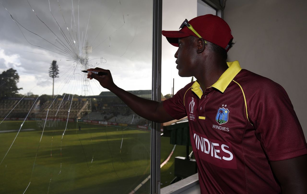 Rovman Powell signs a window he broke at the Harare Sports Club, Ireland vs West Indies, World Cup Qualifier, Group A, Harare, March 10, 2018