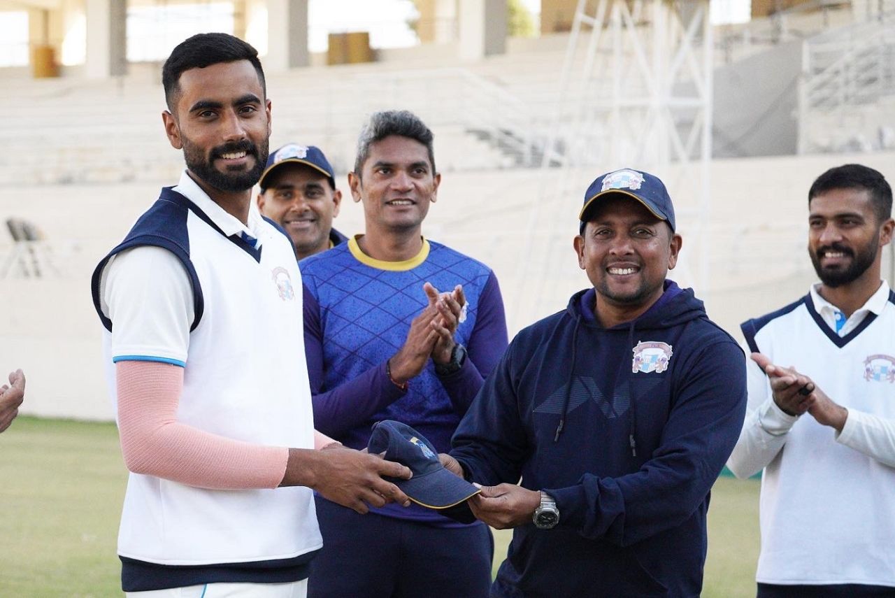 Batting coach Shiv Sunder Das presents Naman Dhir with his first-class cap, Punjab vs Chandigarh, Mullanpur, 1st day, Ranji Trophy, December 13, 2022