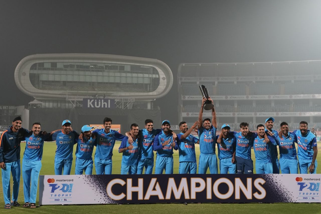Mukesh Kumar has the trophy as India pose after beating Sri Lanka, India vs Sri Lanka, 3rd T20I, Rajkot, January 7, 2023
