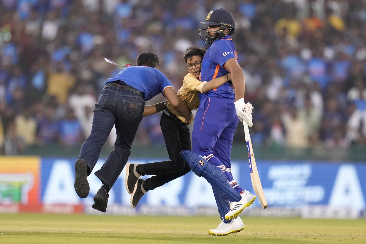 A young fan gets up close and quite personal with Rohit Sharma, and gets rugby-tackled for his troubles, India vs New Zealand, 2nd ODI, Raipur, January 21, 2023