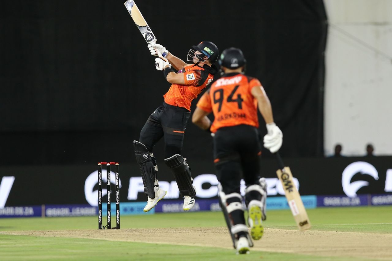 An airborne Tristan Stubbs reverse ramps a ball for six, Sunrisers Eastern Cape vs Durban's Super Giants, SA20, Gqeberha, January 22, 2023