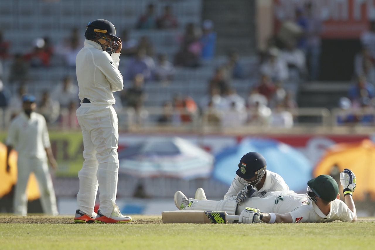Wriddhiman Saha and Steven Smith get into a bit of a tangle as Saha tries to retrieve the ball, India v Australia, 3rd Test, Ranchi, 1st day, March 16, 2017