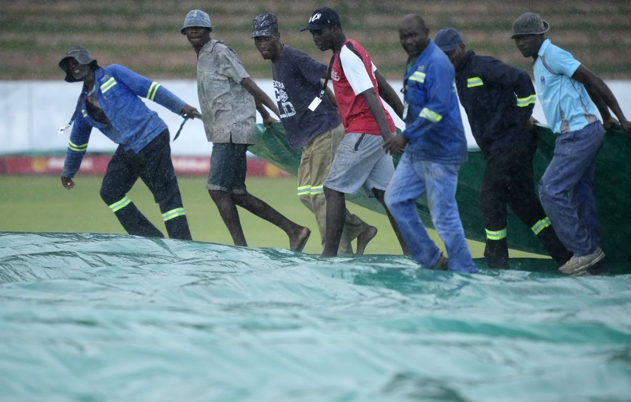 The ground staff get into business after rain stops play at the Queen's Sports Club, Zimbabwe vs West Indies, 2nd Test, Bulawayo, 2nd day, February 13, 2023