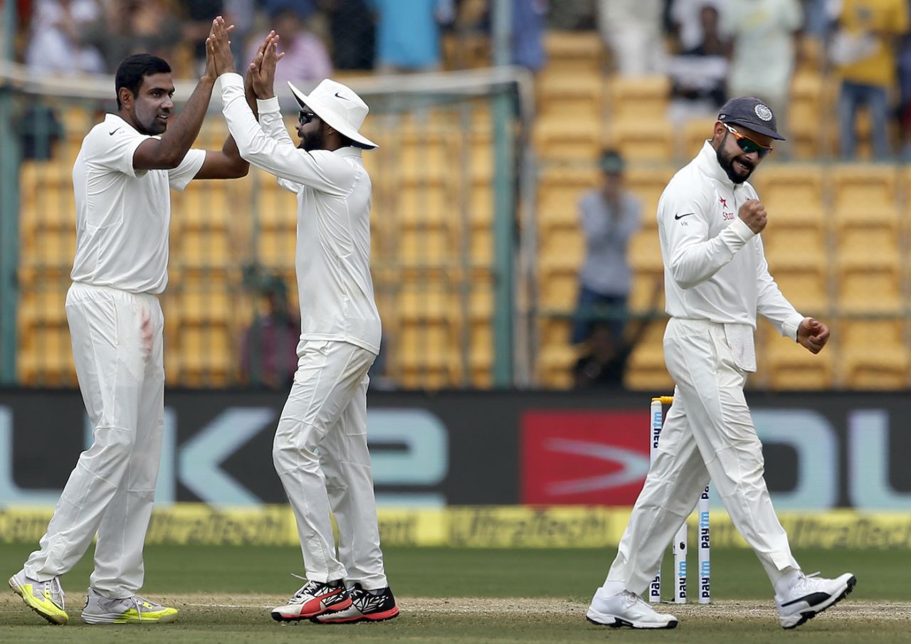 R Ashwin, Ravindra Jadeja and Virat Kohli celebrate the dismissal of Mitch Marsh, India v Australia, 2nd Test, Bengaluru, fourth day, March 7, 2017