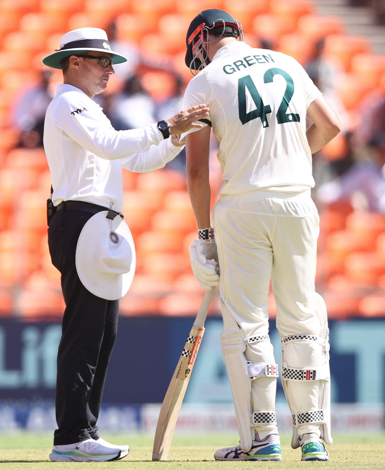 Umpire Richard Kettleborough adjusts the armband - worn by all the Australian players as a mark of respect following the death of Pat Cummins' mother - on Cameron Green's arm, India vs Australia, 4th Test, Ahmedabad, 2nd day, March 10, 2023