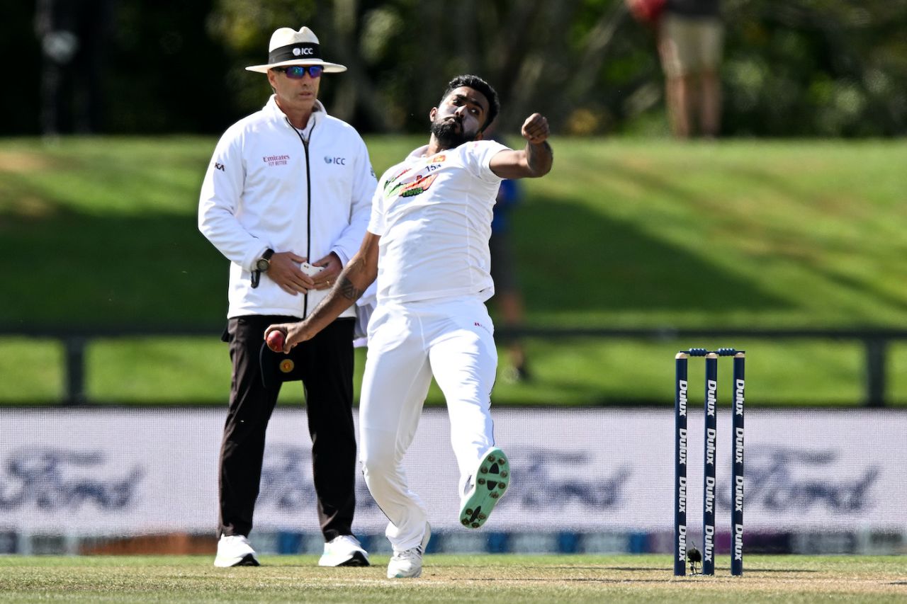 Asitha Fernando bowls with umpire Chris Gaffaney standing behind, New Zealand vs Sri Lanka, 1st Test, Christchurch, 5th day, March 13, 2023