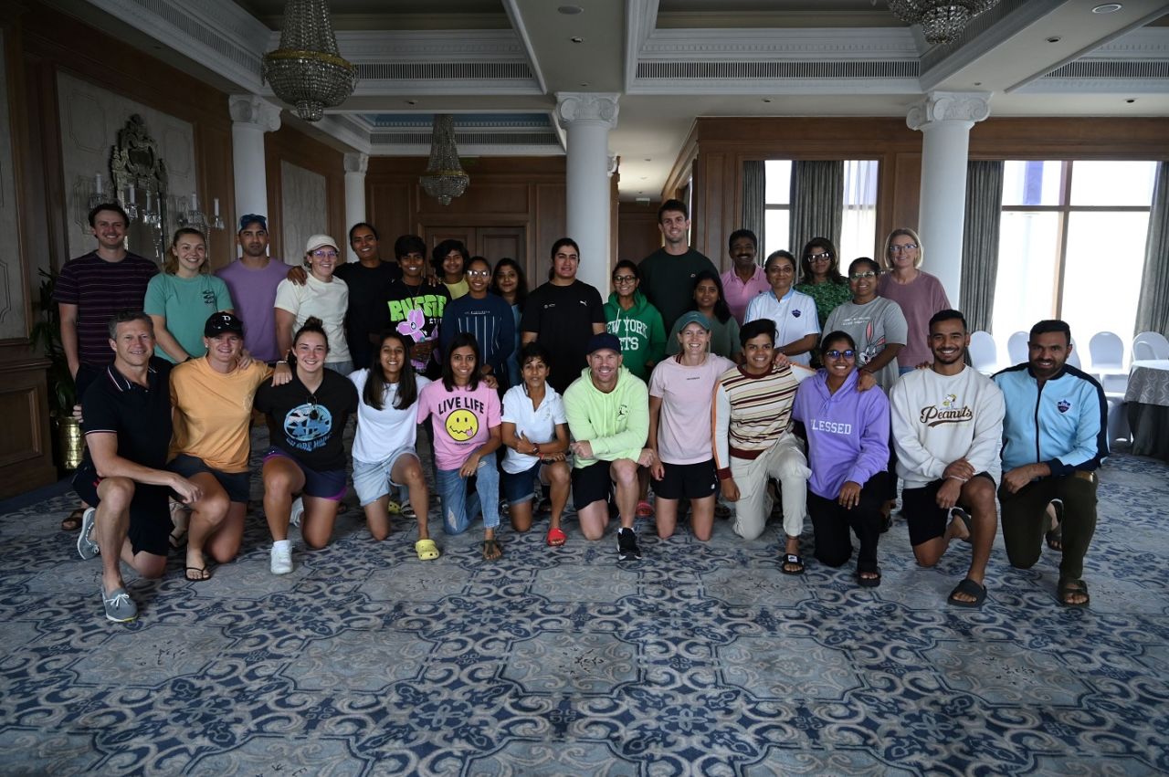 Delhi Capitals Women pose with David Warner and Mitchell Marsh, Mumbai, March 15, 2023