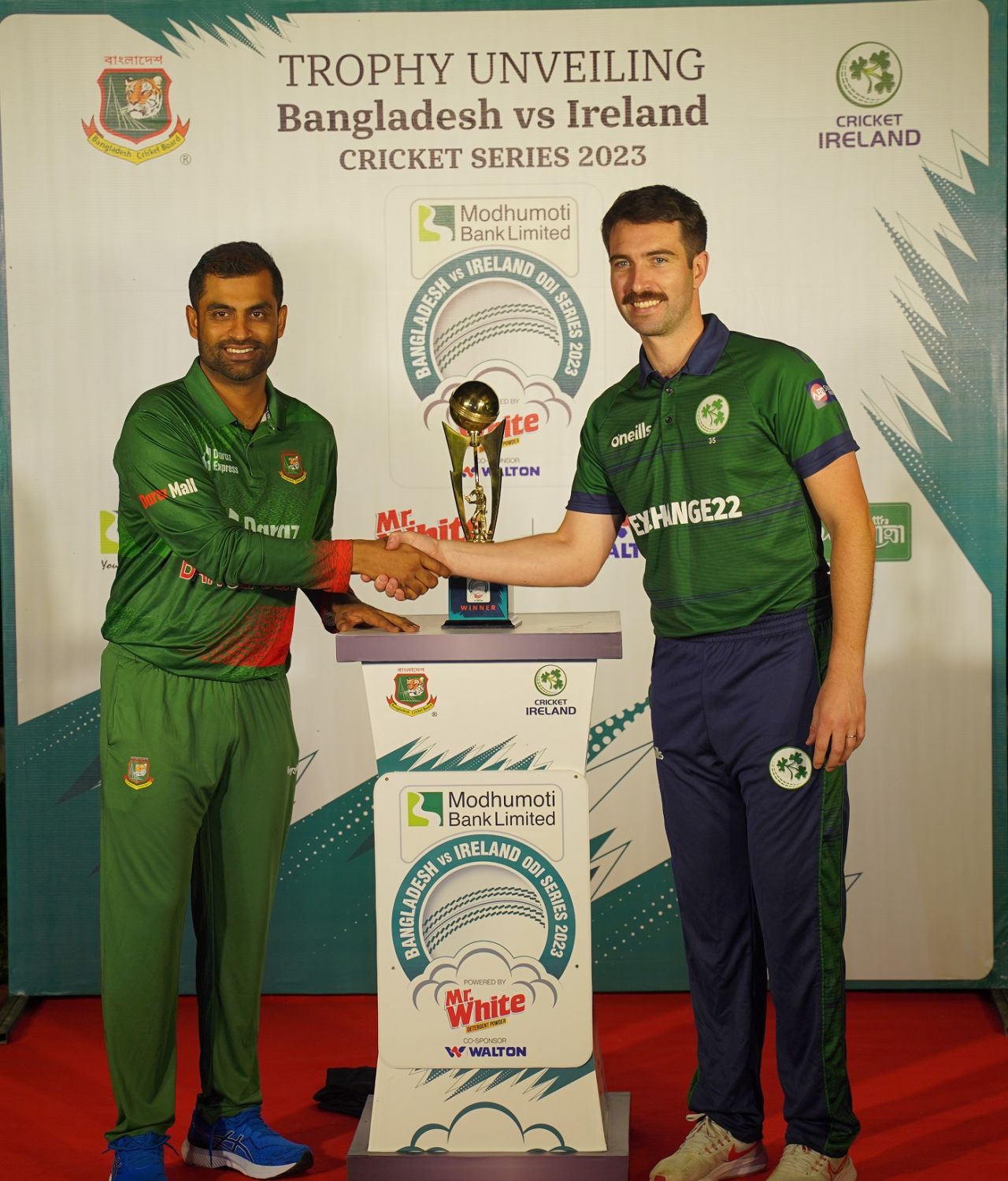 Tamim Iqbal and Andrew Balbirnie pose with the ODI trophy on the eve of the series, Dhaka, March 17, 2023