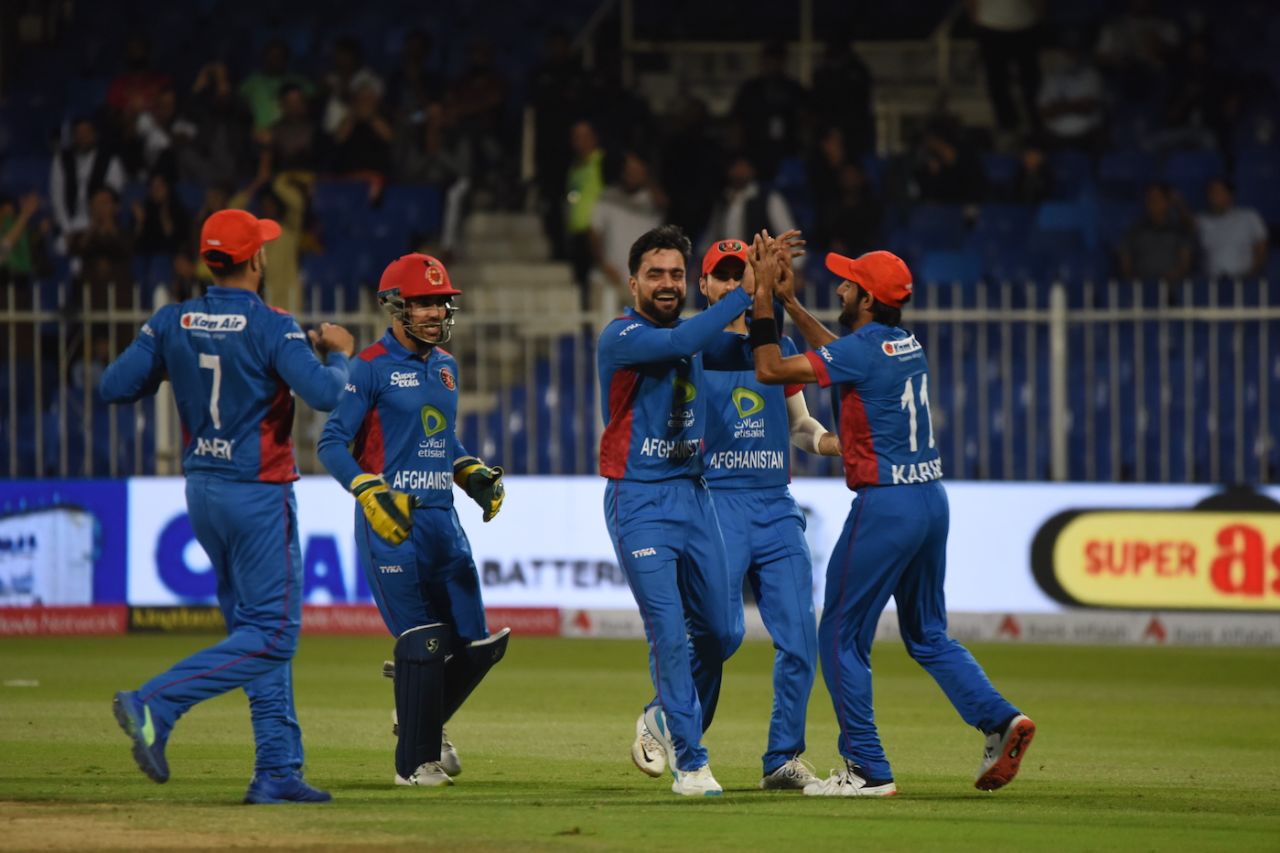 Rashid Khan celebrates after getting the better of Abdullah Shafique, Afghanistan vs Pakistan, 3rd T20I, Sharjah, March 27, 2023
