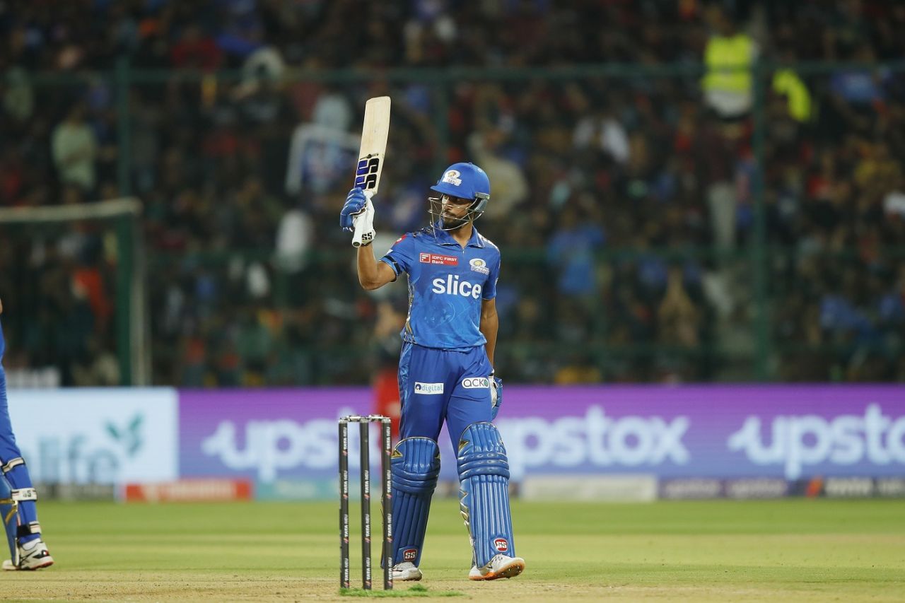 Tilak Varma raises his bat after reaching a well-deserved half-century, Royal Challengers Bangalore vs Mumbai Indians, IPL 2023, Bengaluru, April 2, 2023
