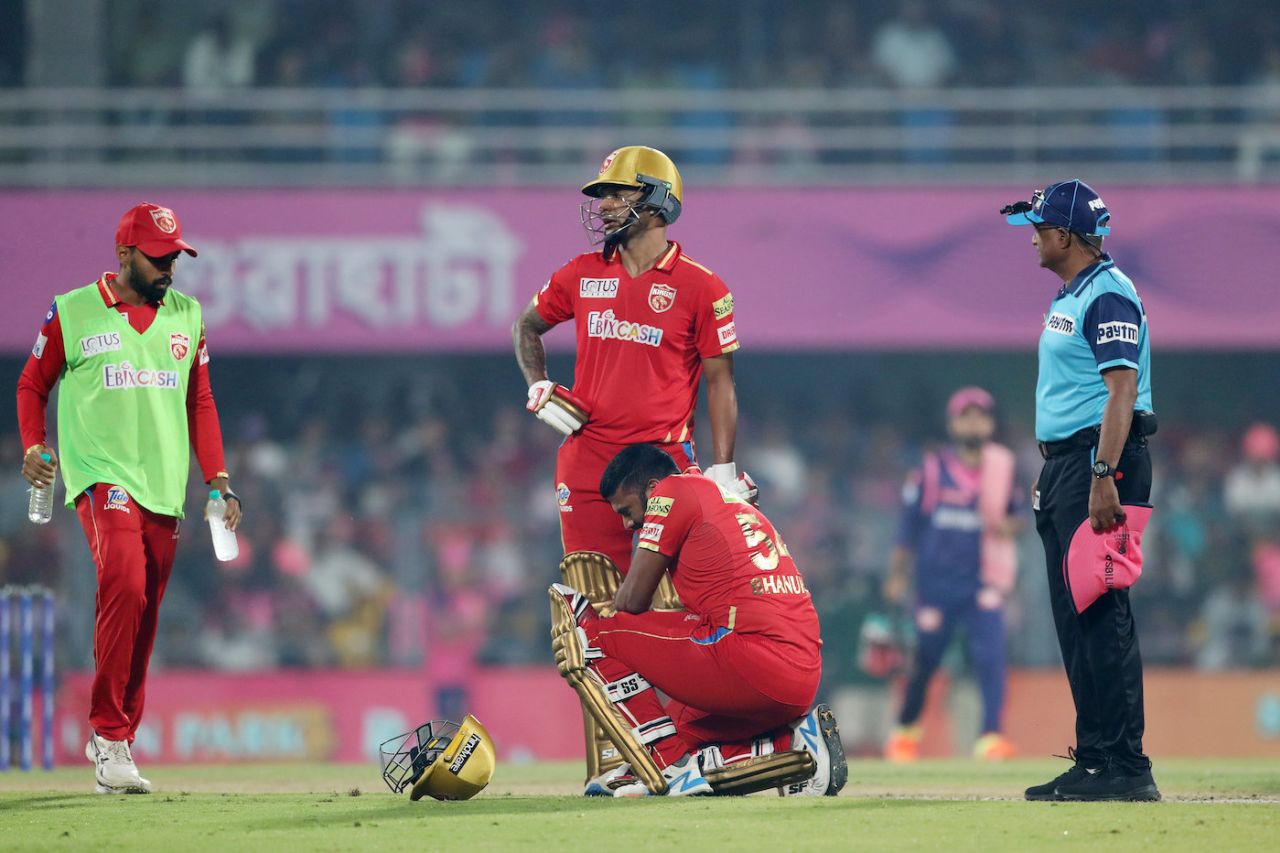 Bhanuka Rajapaksa catches his breath after being hit by a powerful Shikhar Dhawan shot, Rajasthan Royals vs Punjab Kings, IPL 2023, Guwahati, April 5, 2023