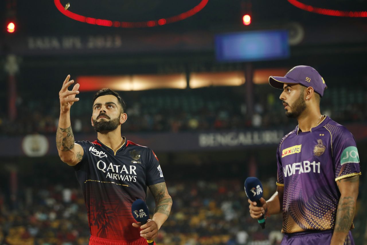 Virat Kohli, filling in as captain in place of Faf du Plessis, flips the coin while Nitish Rana calls, Royal Challengers Bangalore vs Kolkata Knight Riders, IPL 2023, Bengaluru, April 26, 2023