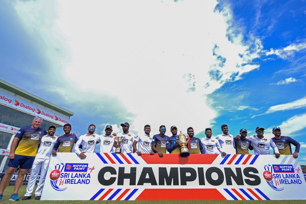 Chris Silverwood joins the Sri Lanka team in posing with the trophy, Sri Lanka vs Ireland, 2nd Test, Galle, 5th day, April 28, 2023