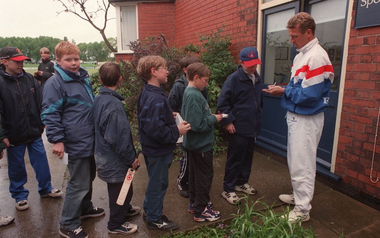 Alec Stewart passes the time with young fans during a rain delay, first day, Derbyshire vs Surrey, County Championship, Derby Racecourse Ground, May 7, 1997