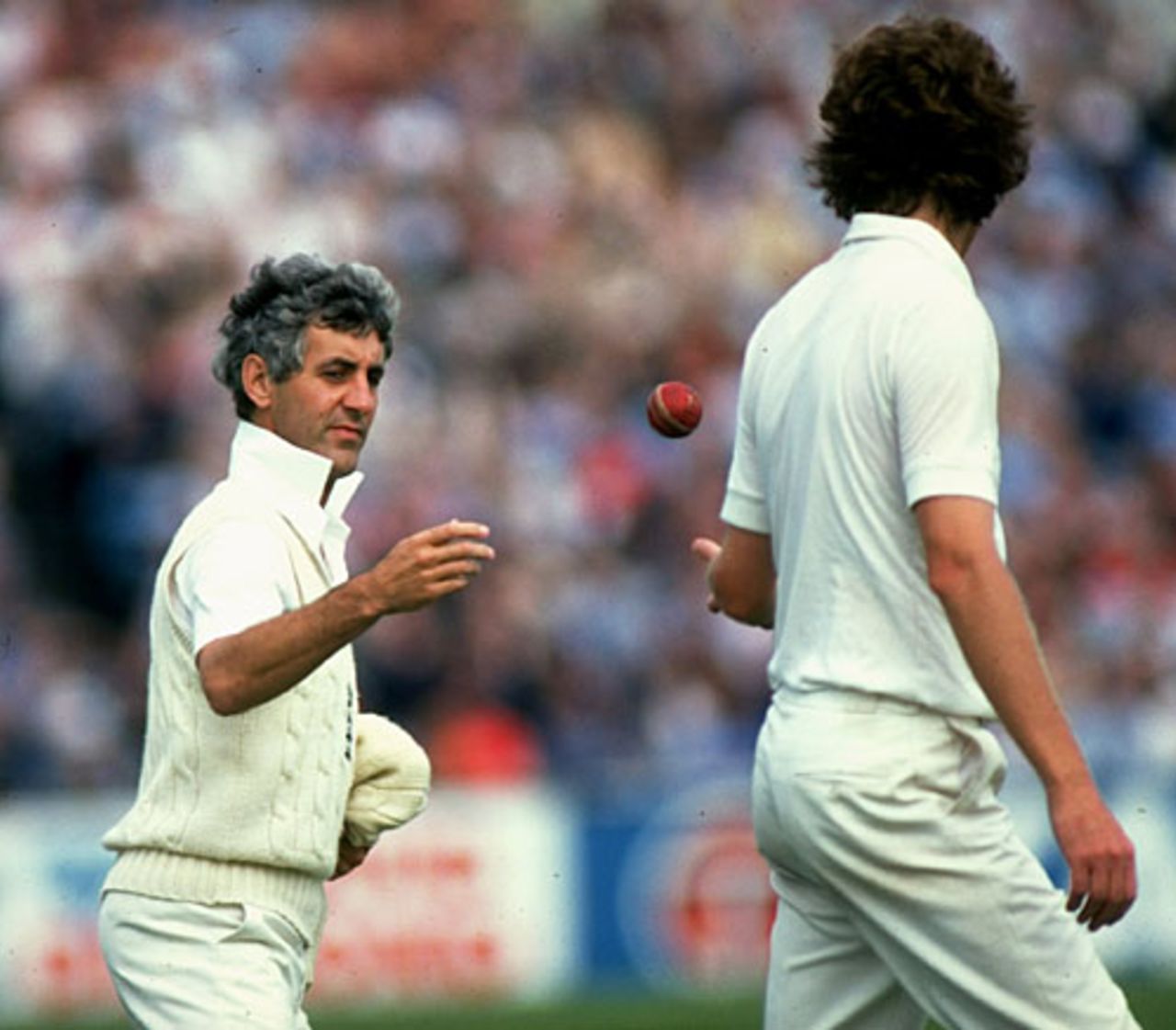 Mike Brearley throws the ball to Bob Willis, fifth Test, England v Australia, Old Trafford, 16 August 1981