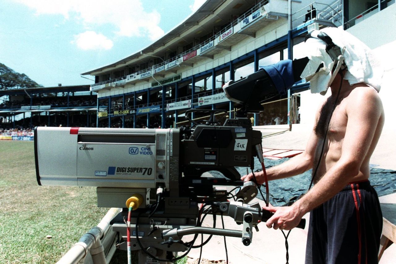 A cameraman films in the hot sun, second day, third Test, West Indies vs England, Port of Spain, Feb 14, 1998