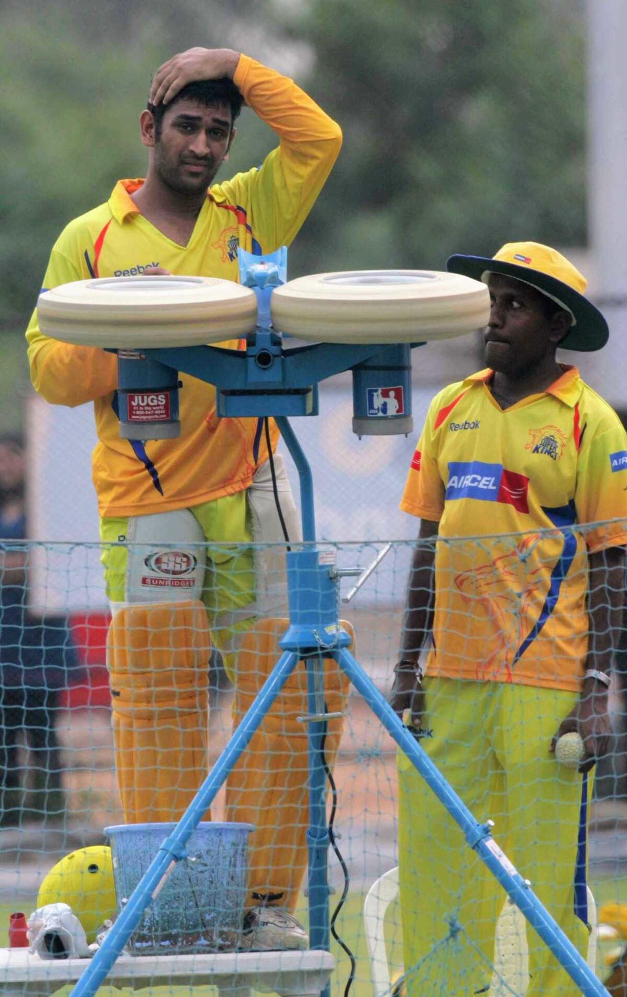 MS Dhoni tries his hand at a bowling machine, Hyderabad, May 26, 2008