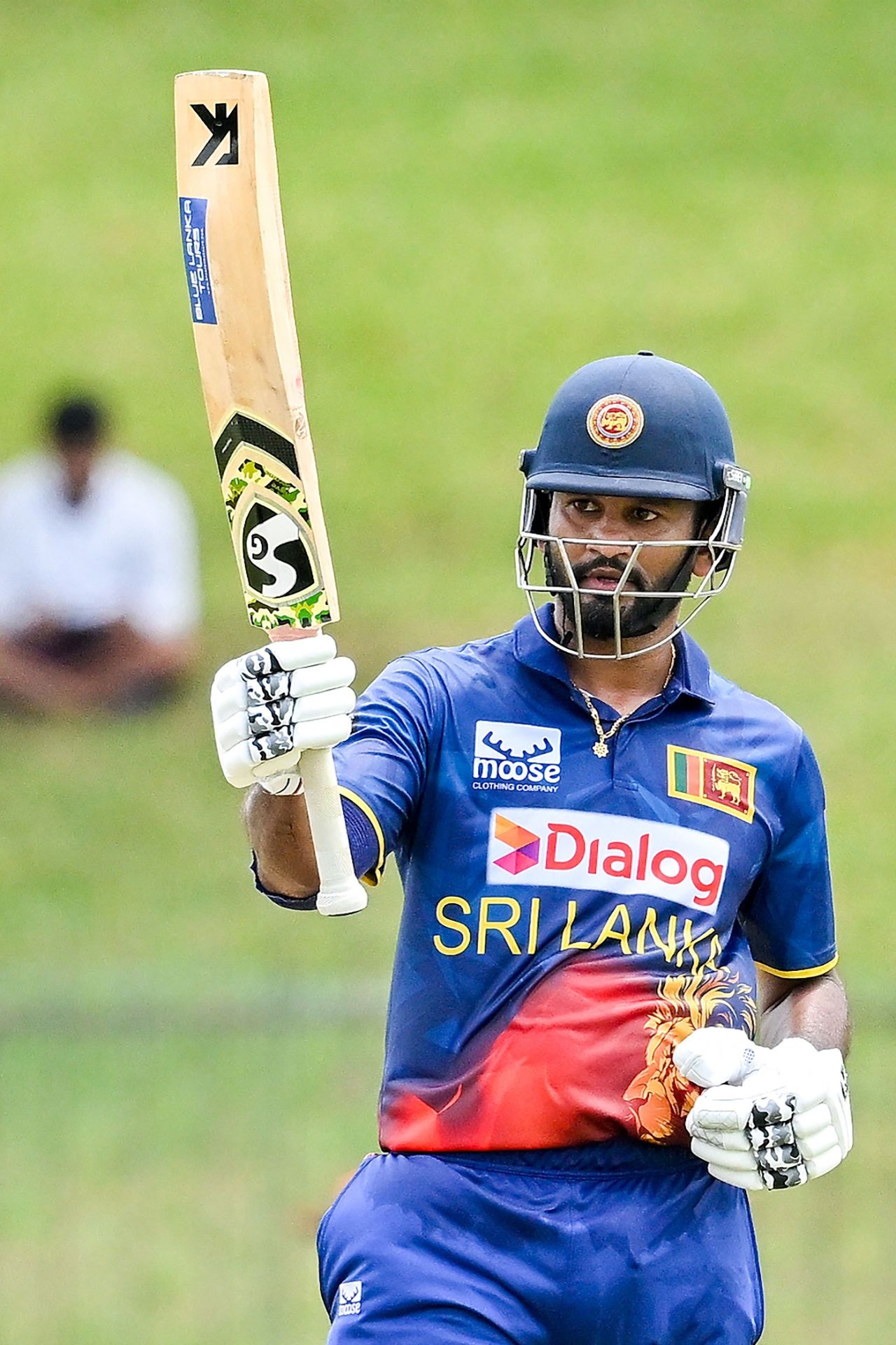 Dimuth Karunaratne raises his bat after hitting a half-century, Sri Lanka vs Afghanistan, 2nd ODI, Hambantota, June 4, 2023