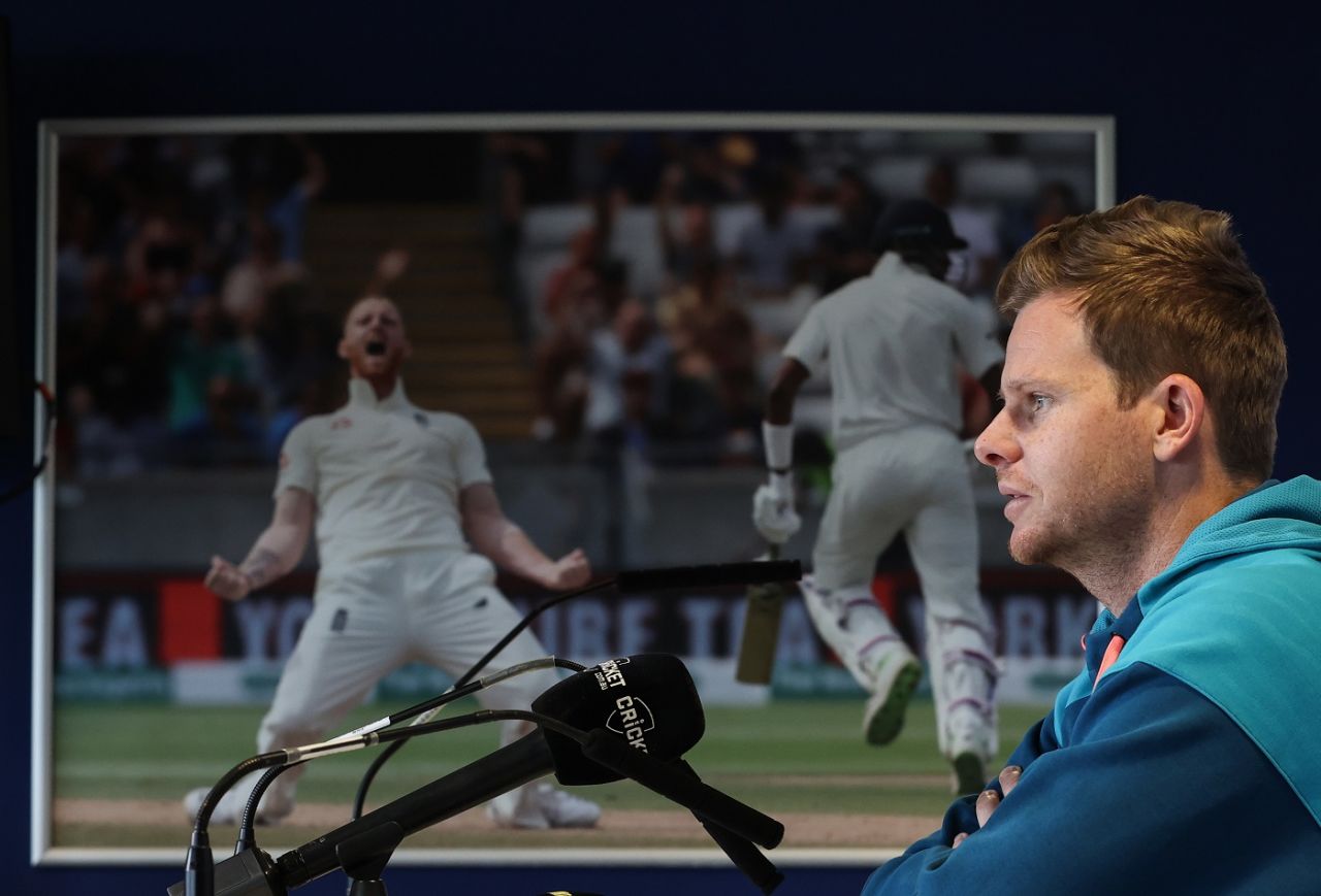 Steven Smith attends a press conference with Ben Stokes lurking in the background, Birmingham, June 14, 2023