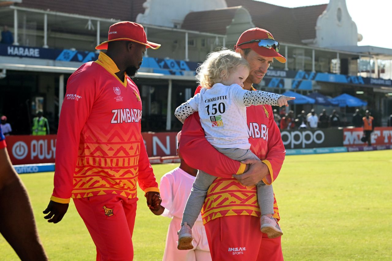 Sean Williams walks out with his daughter, Charlotte, ahead of his 150th ODI game, Zimbabwe vs Nepal, ICC Cricket World Cup Qualifier, Harare, June 18, 2023