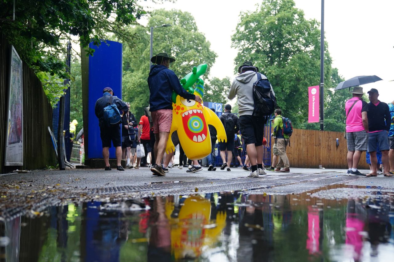 Fans head home early on a wet Birmingham evening, England vs Australia, 1st Ashes Test, Edgbaston, 3rd day, June 18, 2023