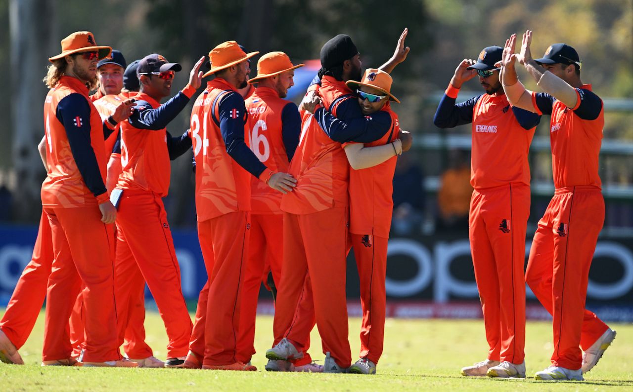 Vikramjit Singh gets swarmed by his team-mates after striking, Netherlands vs Nepal, ICC ODI World Cup Qualifier, Harare, June 24, 2023