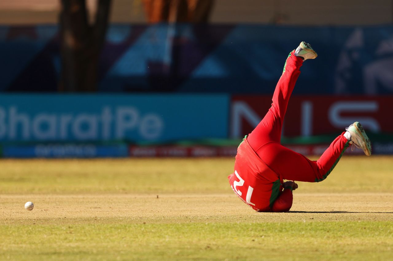 Zeeshan Maqsood tumbles in an attempt to stop the ball, Oman vs Scotland, ICC Cricket World Cup Qualifier, Bulawayo, June 25, 2023