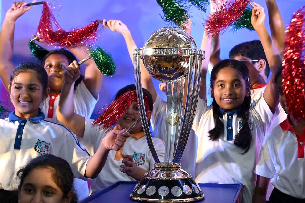Young girls with the World Cup trophy in Mumbai, July 4, 2023