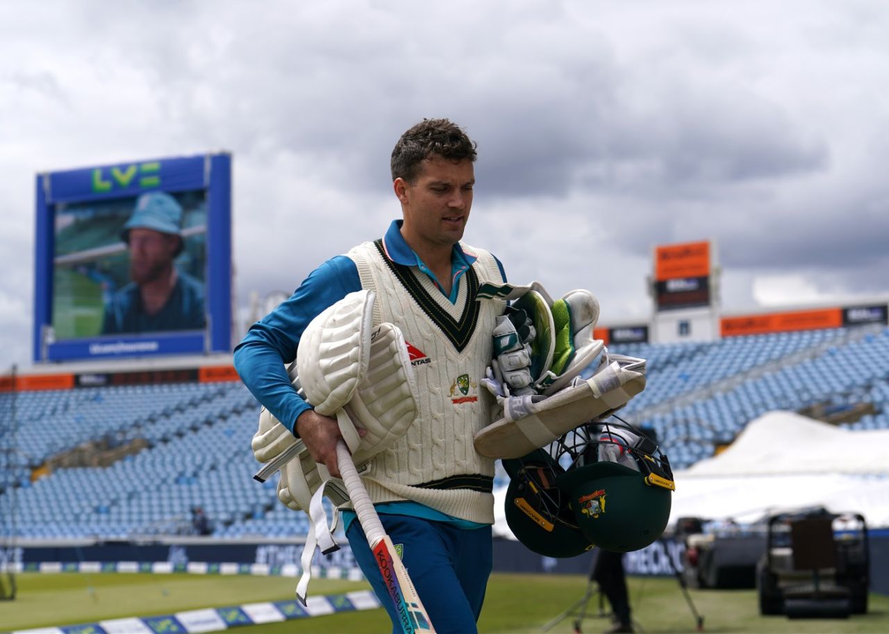 Alex Carey crosses the outfield at Headingley while Ben Stokes looms on the big screen, England vs Australia, Headingley, July 5, 2023