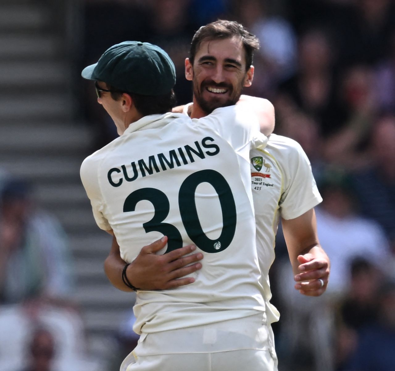 Pat Cummins and Mitchell Starc celebrate after colliding trying to take the catch that sent Harry Brook back, England vs Australia, 3rd Test, 4th day, Headingley, July 9, 2023