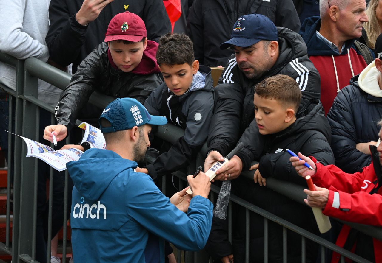 Mark Wood signs autographs during the rain delay, England vs Australia, 4th Ashes Test, Old Trafford, 4th day, July 22, 2023