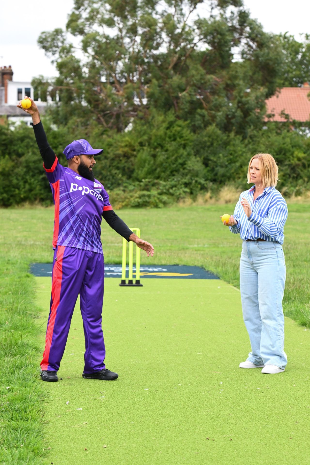 Adil Rashid shows his legbreak to Kimberley Walsh of Girls Aloud fame during a Hundred sponsor's event, July 24, 2023