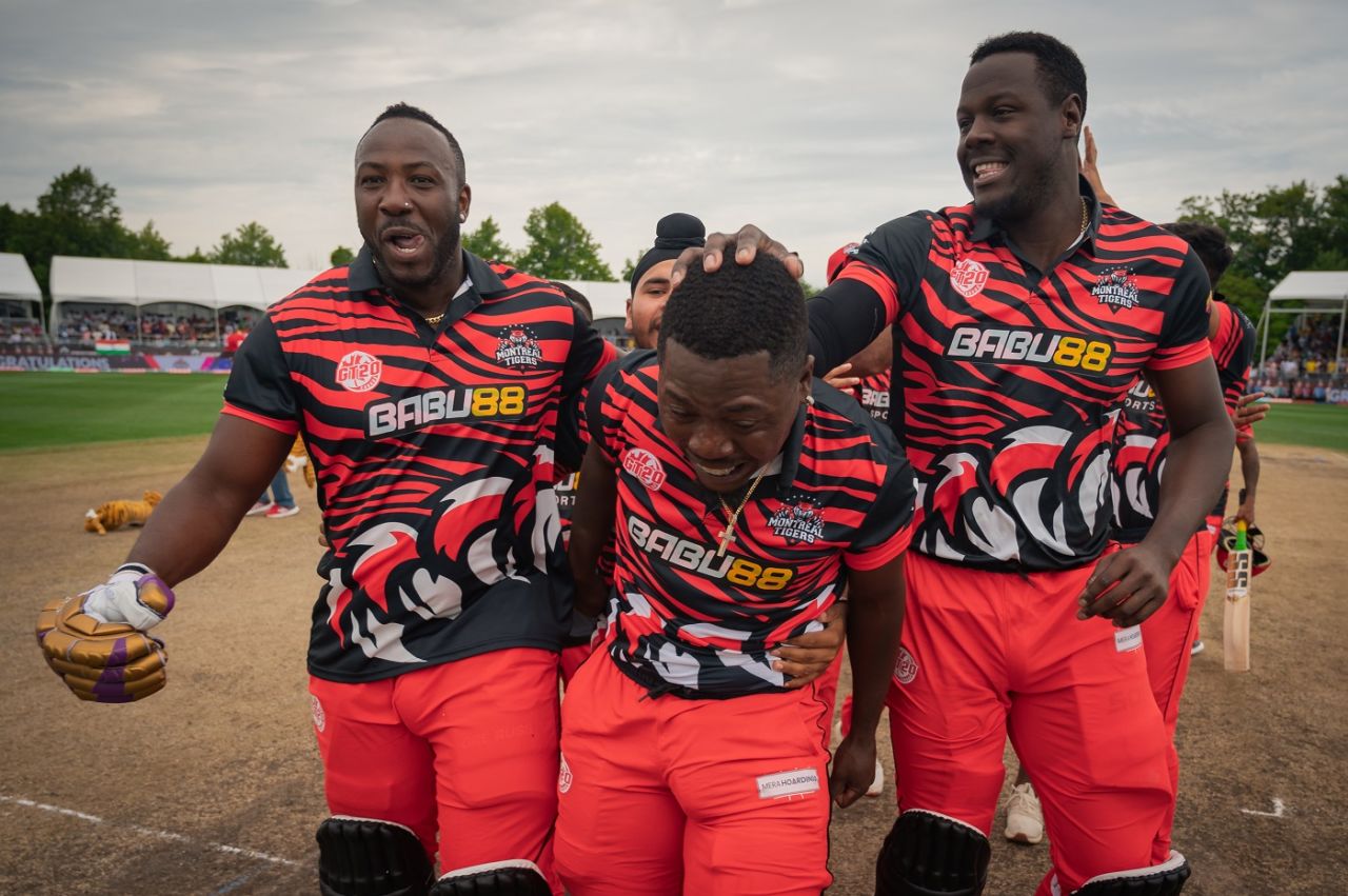 Sherfane Rutherford is congratulated by Andre Russell and Carlos Brathwaite after winning the final, Surrey Jaguars vs Montreal Tigers, Global T20 Canada, Final, Brampton, August 06, 2023
