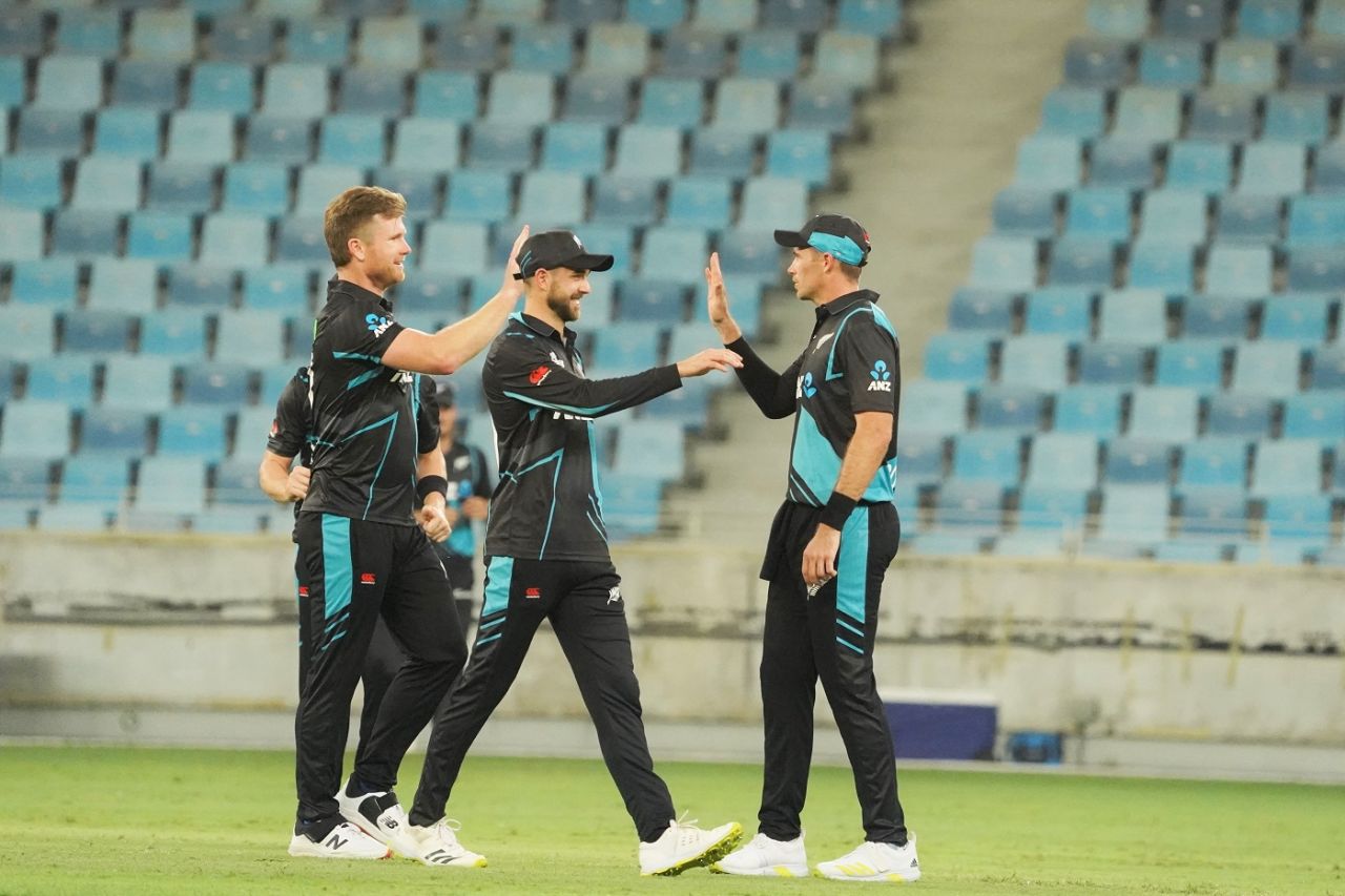James Neesham, Chad Bowes and Tim Southee celebrate a wicket, UAE vs New Zealand, 1st T20I, Dubai, August 17, 2023