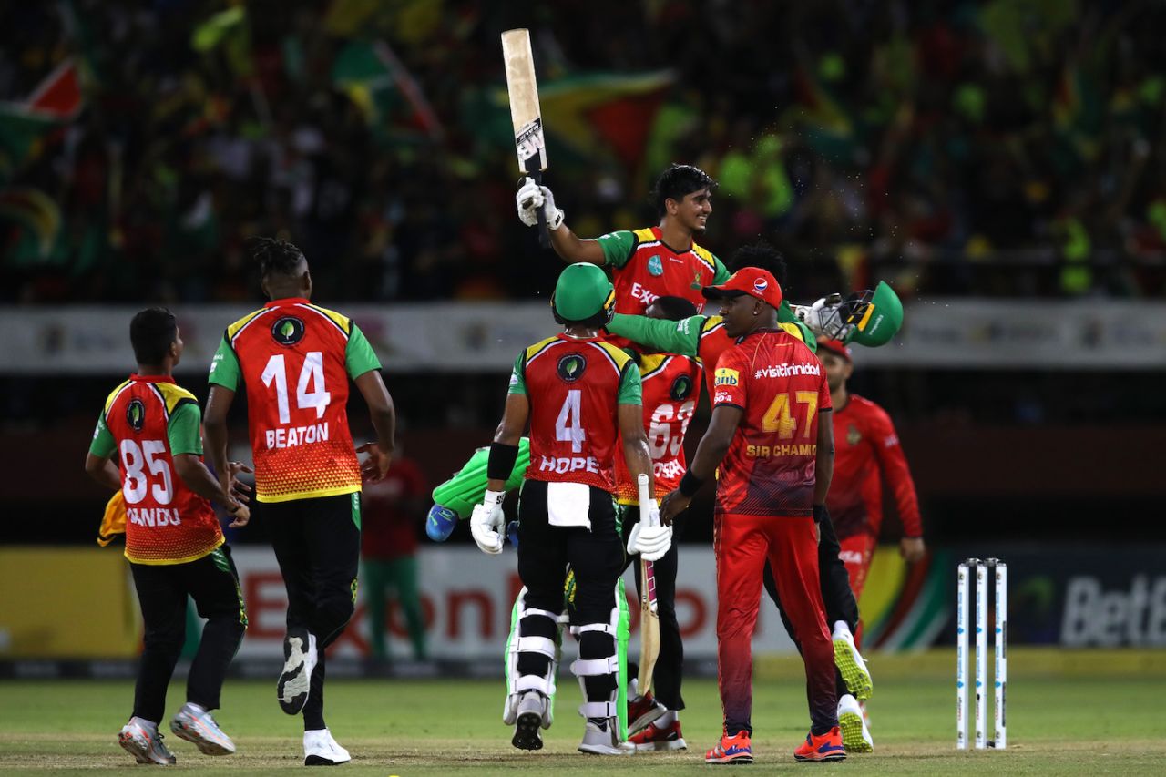 Saim Ayub is lifted by jubilant team-mates after he hit the winning runs, Guyana Amazon Warriors vs Trinbago Knight Riders, CPL 2023, final, Providence, September 24, 2023