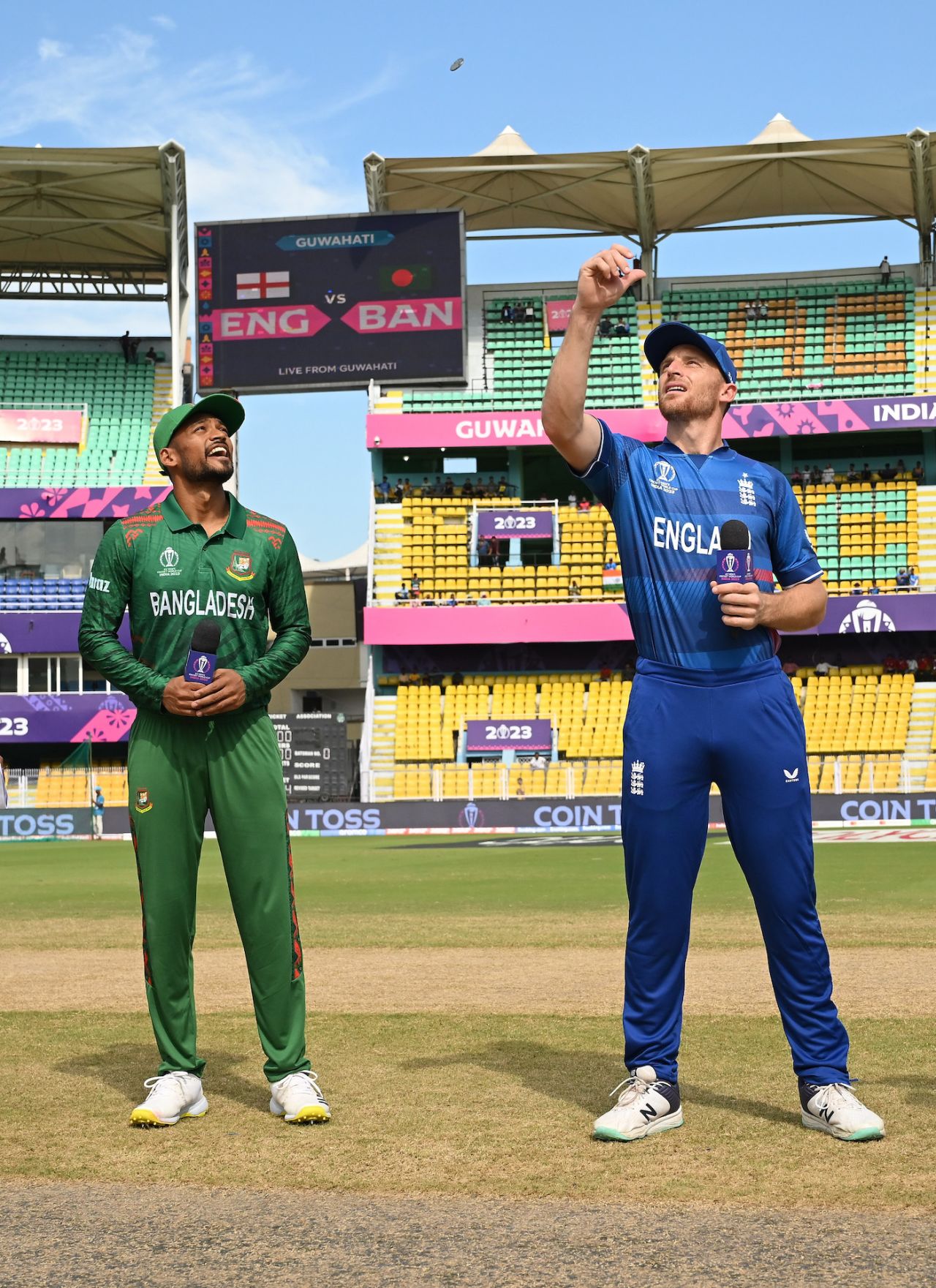 Jos Buttler flips the coin; Najmul Hossain Shanto, leading in Shakib Al Hasan's absence, called right and opted to bat, Bangladesh vs England, World Cup warm-up, Guwahati, October 2,, 2023