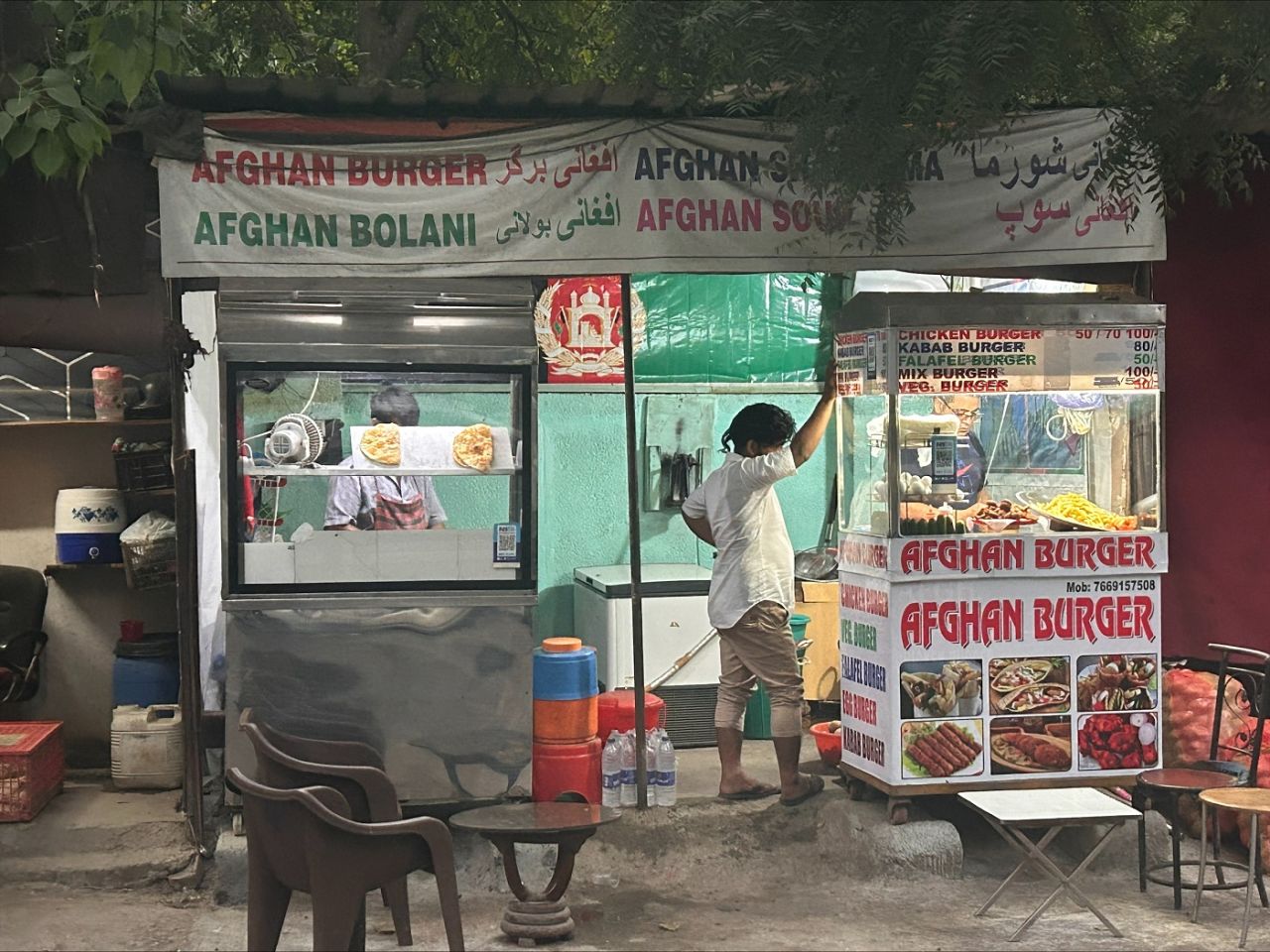 An 'Afghan burger' shop at work in Delhi's Lajpat Nagar area, New Delhi, October 8, 2023