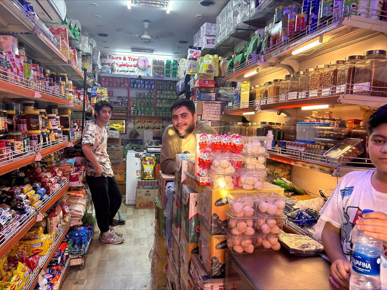 Mohammed Usman (r) with his younger brother in his dry fruits shop, New Delhi, October 8, 2023