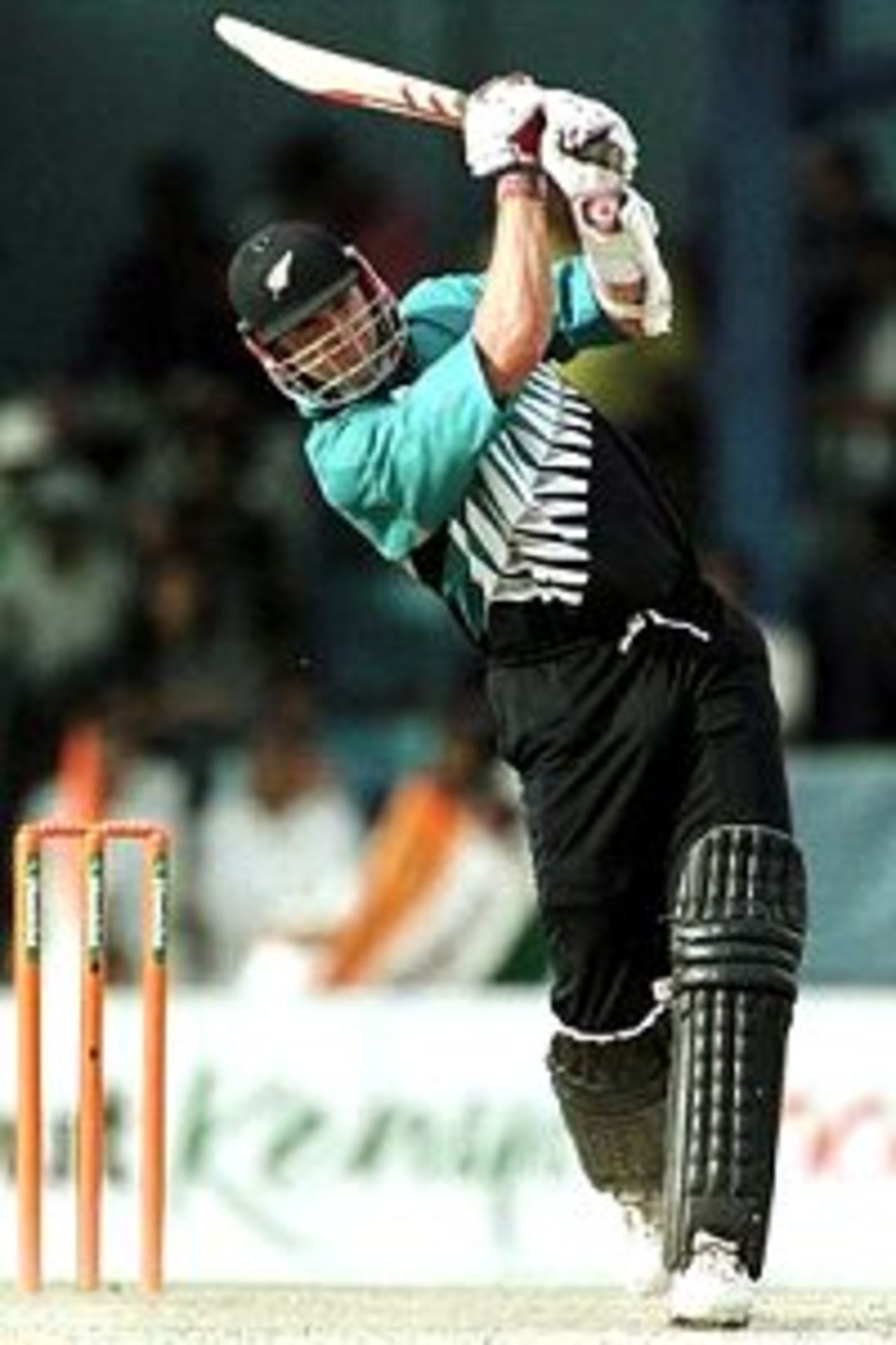 15 Oct 2000: Chris Cairns of New Zealand hits a six on his way to a century during the New Zealand v India final of the ICC Knockout Tournament at the Gymkhana Ground, Nairobi, Kenya