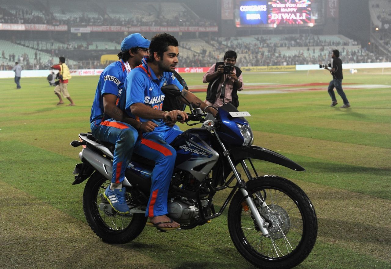 Virat Kohli goes for a ride with Player of the Match Ravindra Jadeja, India vs England, 5th ODI, Eden Gardens, October 25, 2011