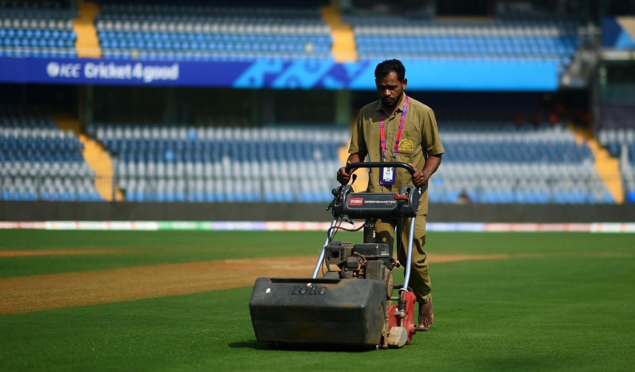 A member of the Wankhede groundstaff tends to the pitch before the game, India vs Sri Lanka, Men's ODI World Cup, Wankhede, November 02, 2023