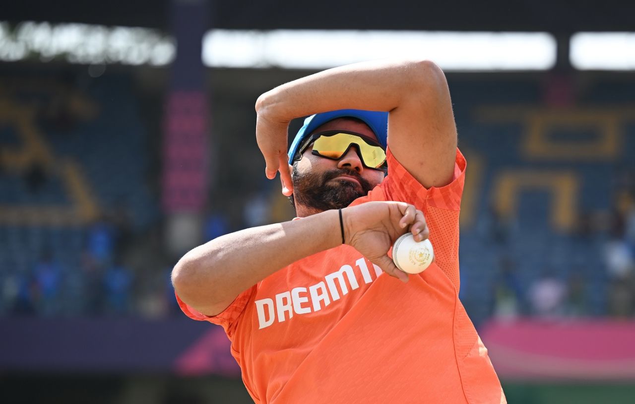 Rohit Sharma rolls his arm over in warm-up, India vs Netherlands, Men's ODI World Cup, Bengaluru, November 12, 2023