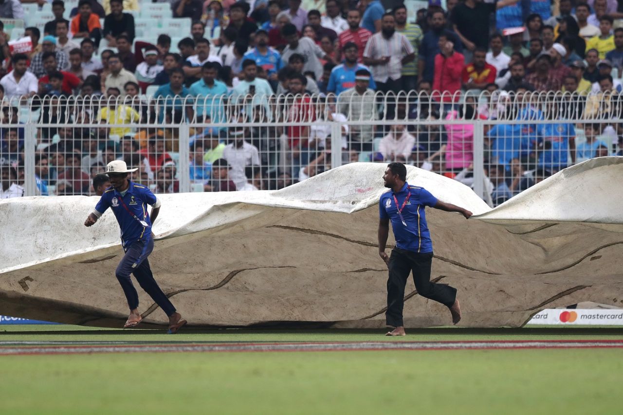Ground staff bring the covers on, Australia vs South Africa, Men's ODI World Cup, 2nd semi-final, Kolkata, November 16, 2023
