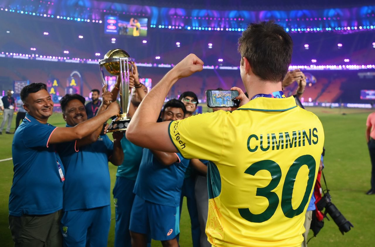 Pat Cummins takes a picture of the backroom staff with the World Cup trophy, India vs Australia, Men's ODI World Cup final, Ahmedabad, November 19, 2023